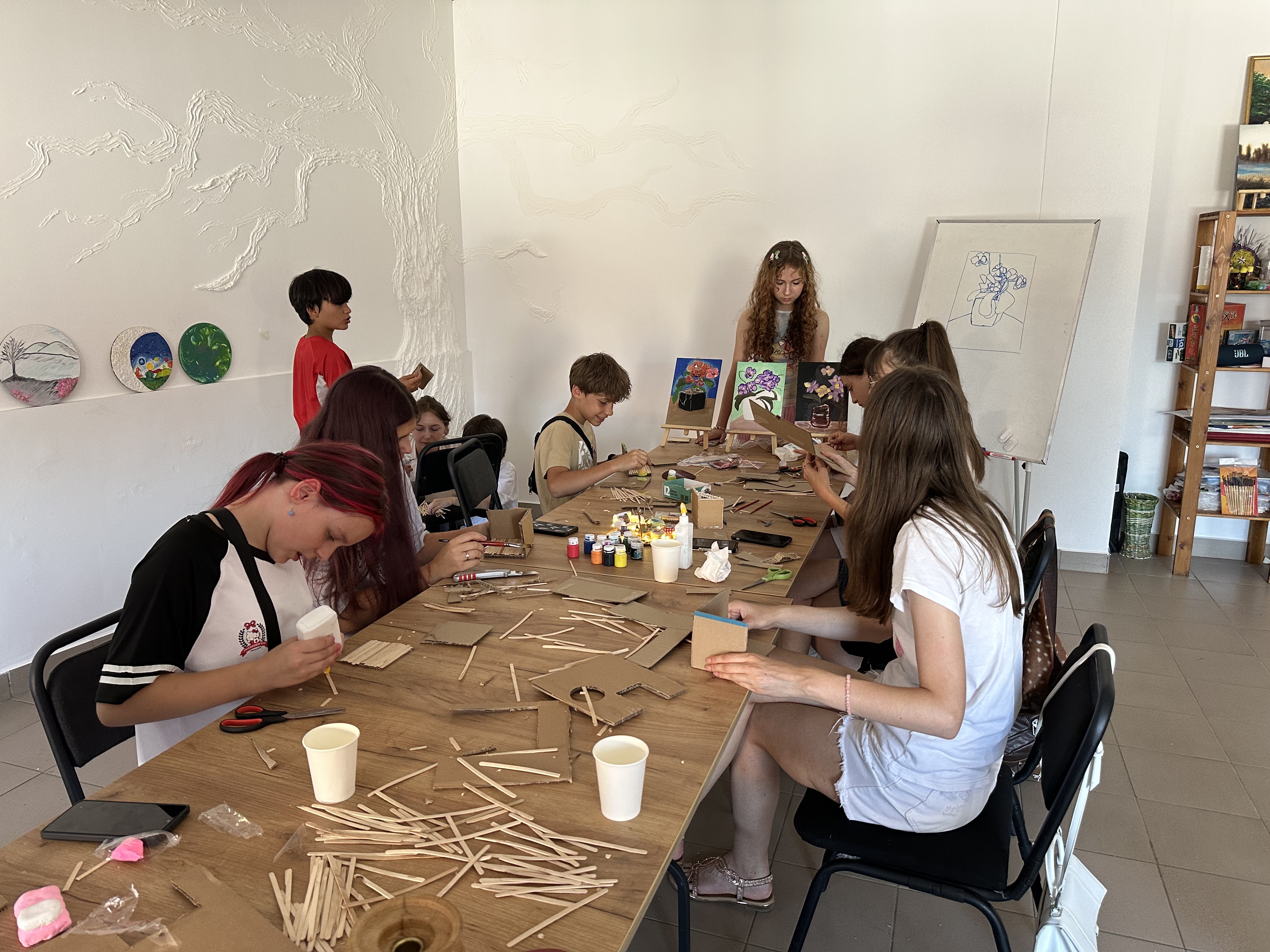 Teenagers creating handmade art together